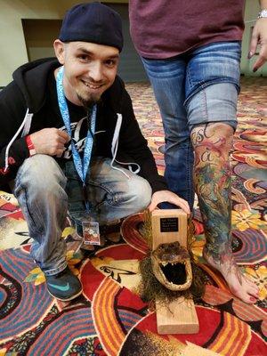 Curtis Daniel with a 1st. place trophy for best Louisiana theme tattoo!