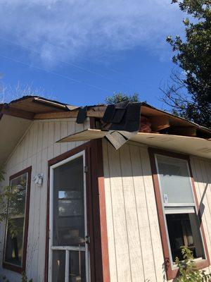 This picture is a storage shed deteriorating.