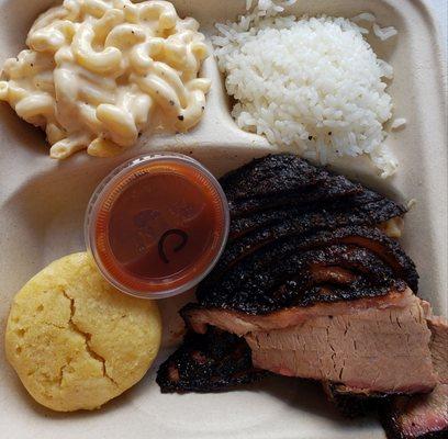 Brisket plate with smoked mac n cheese, cornbread muffin, rice and our housemade bbq sauce.