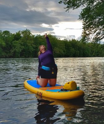 Instructor Angie demoing her camel pose during SUP Yoga at Lake Nockamixon.