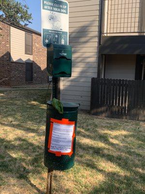 Empty doggie bag area & resident note (not mine) stating how disappointed they are / people leave their dog crap it never gets cleaned