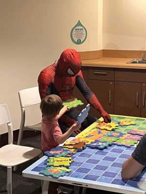 Spider-Man playing with the kids