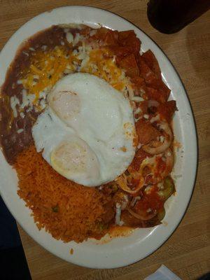 Chilaquiles with eggs rice and beans