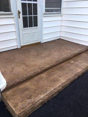 Stamped conrete steps with rock faced edge