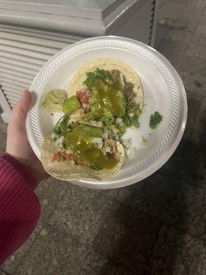 Lengua and pork tacos with pico, guac, salsa verde, onions, cilantro, and lime.