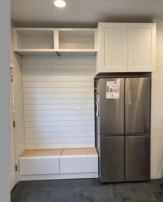 "Mud room" area created, the fridge and cabinet where the old weird opening was.