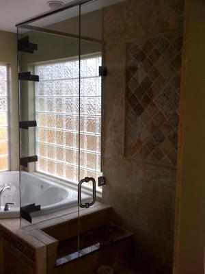 Glass shower, with bench, tile back splash (please excuse tape on glass)