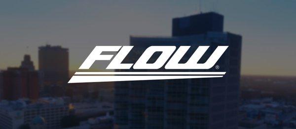 Flow Automotive business logo over Winston-Salem, NC skyline