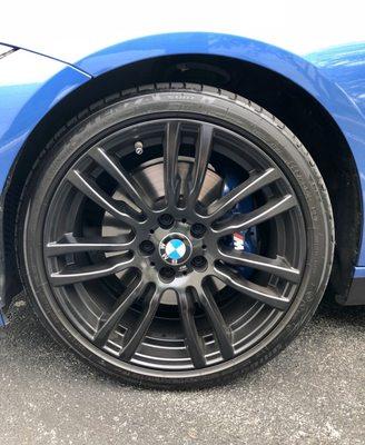 Brake calipers done in Bmw's M blue with logo and hash marks. And black rims done. Rims were originally brushed finished.