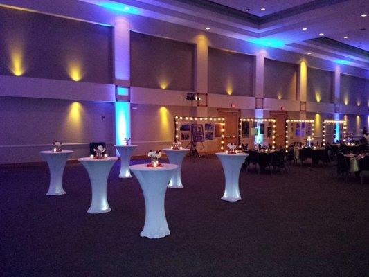 Up lighting along the wall and under each cocktail table at the Killeen Civic and Conference Center provided by IES