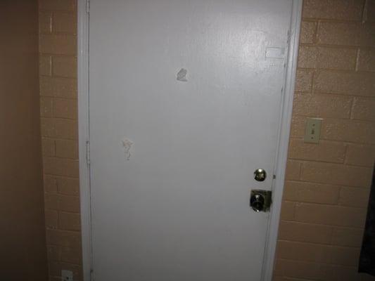 Check out the kleenex plugging the holes on the inside of motel room door.