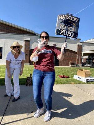 05.07.20  teachers greeting seniors as they pick up their cap and gowns - Class of 2020