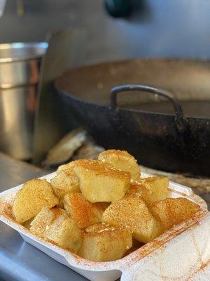 Baked potatoes tray, topped with our homemade butter and cajun seasoning.