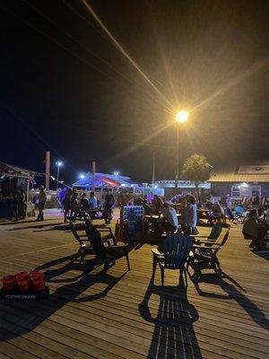 Outdoor seating and games. Two new sand volleyball courts.