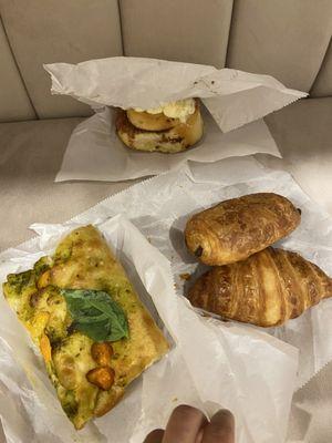 Cinnamon bun,  vegan focaccia,  chocolate croissant,  regular croissant