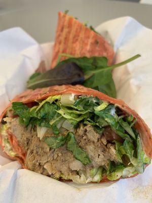 Spicy Pork Wrap (slow braised pork shoulder, signature spicy sauce, garlic aioli, mixed greens, onions, habaneros, tomato flour tortilla)