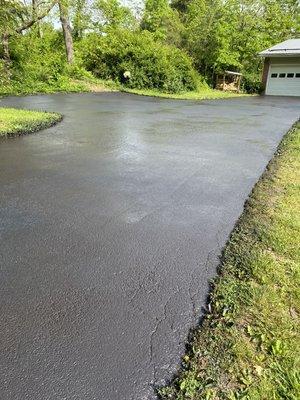 Deteriorating cracked pavement, freshly seal. Neyra force sealer 5-6 yr coat. Sealed up fairly well.