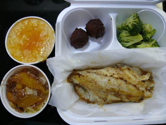 3 pc Catfish (grilled) dinner with broccoli & hushpuppies. Also a Lg side of Mac & Cheese and a Lg Peach Cobbler.