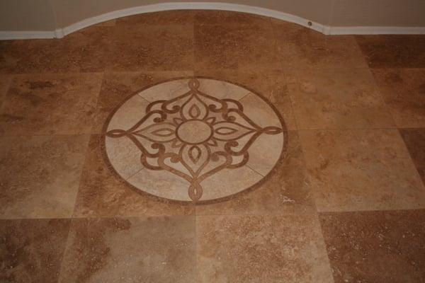 Travertine flooring with medallion.