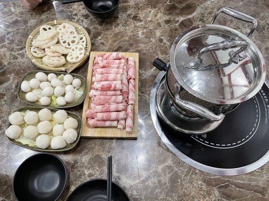 Lotus root Quail eggs Fish balls Premium beef slices (fatty beef, possible belly?)