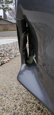 Front bumper, passenger side, broken and cracked