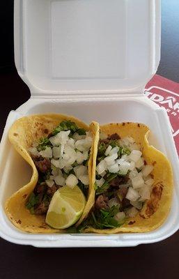 Street Tacos (I believe Carne Asada) with onions and cilantro. I did add some of the salsa and sauce to enhance an already amazing meal.