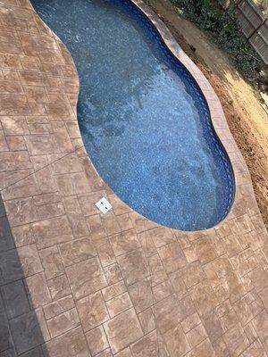 Stamped concrete around pool