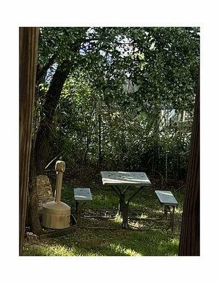 Picnic table outside in yard.