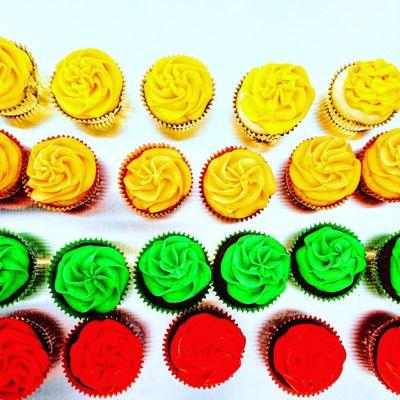 Gold, orange, green and red Bridges inspired cupcakes.