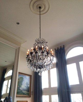 Installed a chandelier in a two story living room. A light lift was also installed so the fixture can be lowered for cleaning.