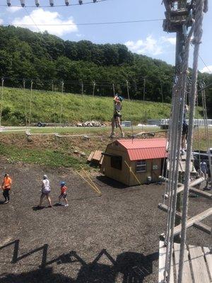 Kid going across one of the obstacles with boards that shifted as you walk