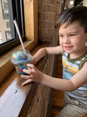 Little guy loving the tropical rainbow