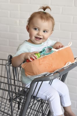 Grocery shopping with a toddler can be a challenge. Not when you take your Snuggwugg Toddler travel pillow with you! Occupies & Entertains