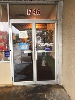 Outside - Entrance door of the narrow store front