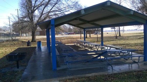 Shelter with picnic tables and grille