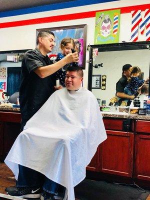 This is Mark with our daughter "yup he's a pretty special barber" who else takes the time to make your 2 year old smile