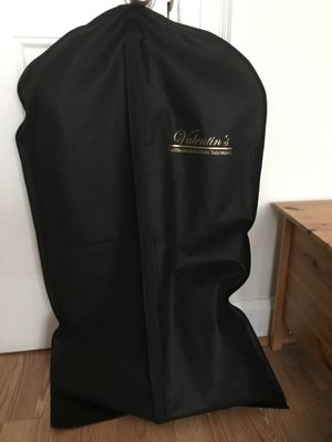 Black Suit inside protective case