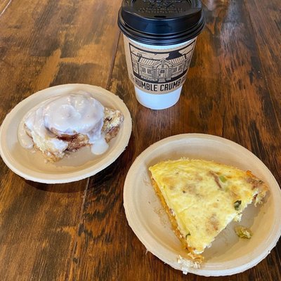 My husbands mini cinnamon roll, bacon, spinach and grits (in the crust) quiche, and coffee.