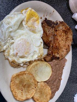 Pork chop and eggs  breakfast