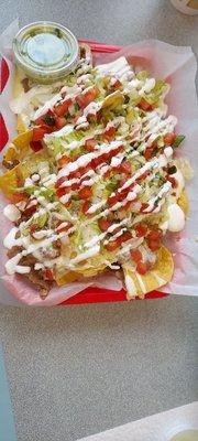 Nachos.  Fresh and delicious. Enough for two. Anything you want added. Guacamole is great.