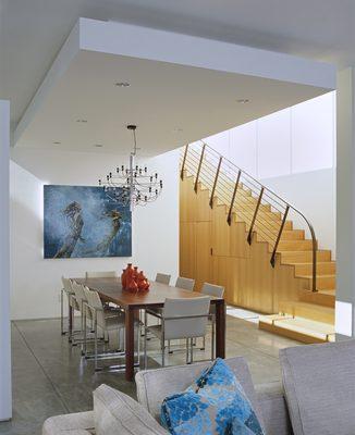 Oak floors at the second level become stairs.  A powder room and ample storage are concealed underneath.