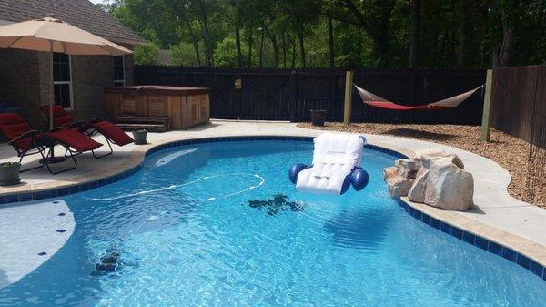 The finished pool by Blankenstein's, with custom tile work at bottom. Also, Above-ground spa at left.