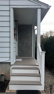 New porch with vinyl railing installation.