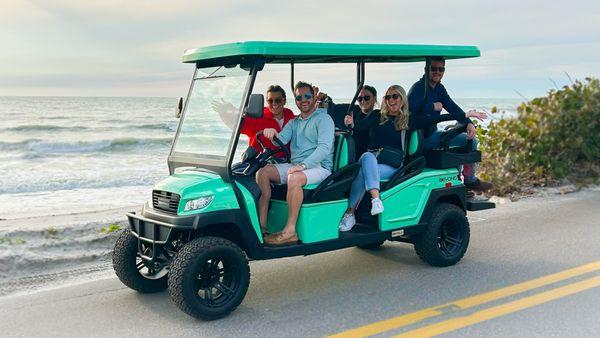 Our new 2024 6-seater premium "mint" color golf cart on Casey Key Road.