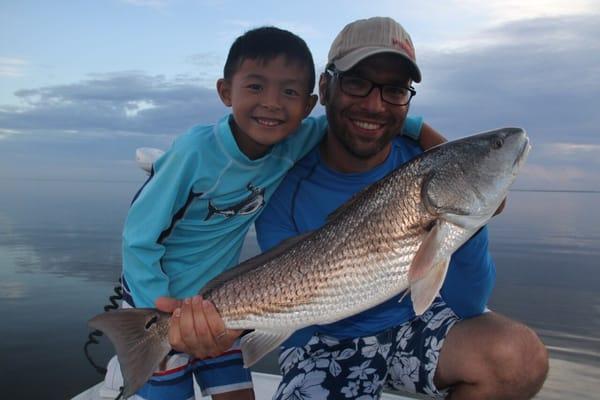 Dad and son with nice redfish early morning on mosquito lagoon!