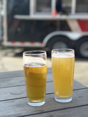 Hazy IPA and Blonde Ale with food truck in the background