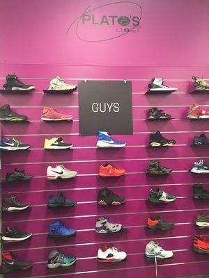 A guys shoe display wall.