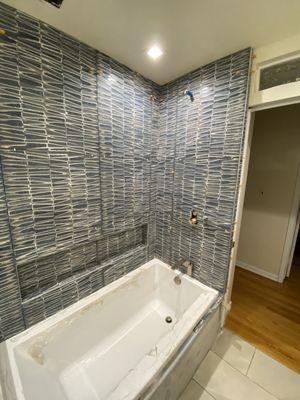 Tile will arrive soon and will be installed on the tub surround.