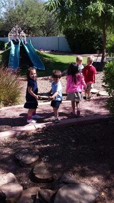 Working together to keep our outdoor classroom beautiful.