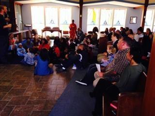 Children gather up front during service